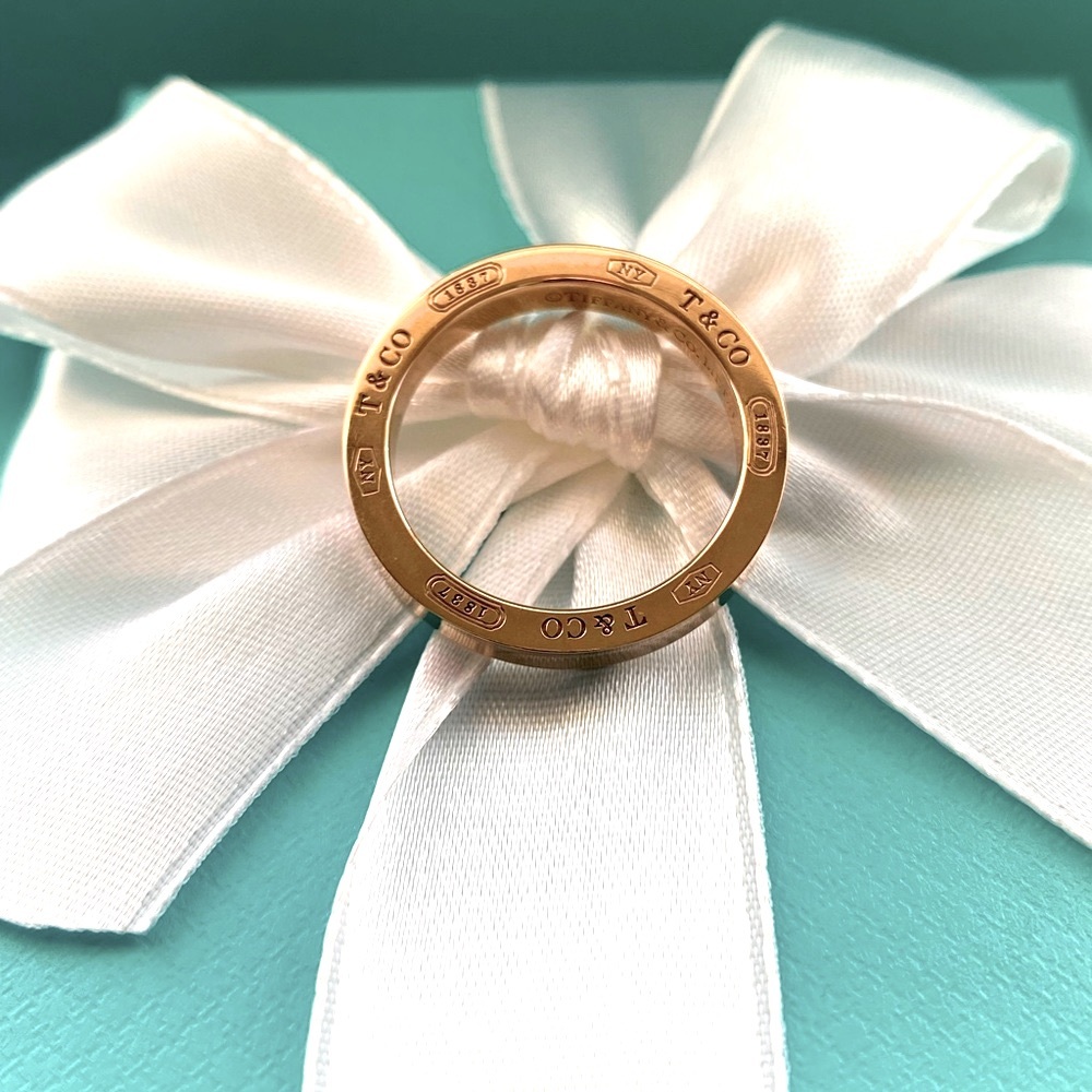 Tiffany & Co. ring 18 k solid Gold it has that Tiffany Rosish color gold to it.